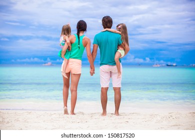 Back View Of Young Family Looking To The Sea In Philippines