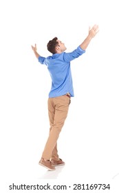 Back View Of A Young Fashion Man Holding His Hands Up, Celebrating.