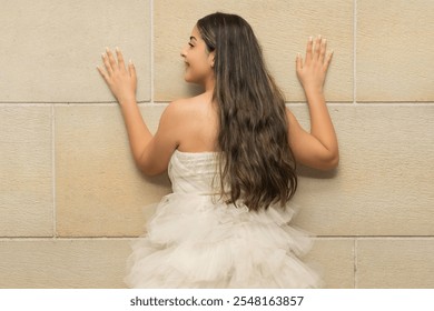 Back view of young female model posing in long white lace dress - Powered by Shutterstock