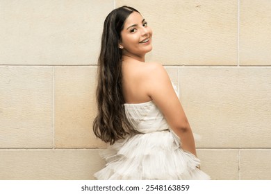 Back view of young female model posing in long white lace dress - Powered by Shutterstock