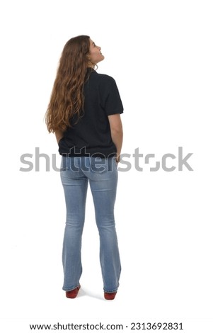 back view of young girl  looking up on white background