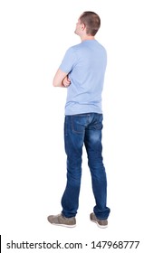 Back View Of Young Man In T-shirt And Jeans  Looking.   Standing Young Guy. Rear View People Collection.  Backside View Of Person.  Isolated Over White Background.