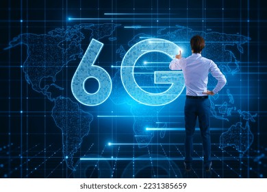 Back view of young man using glowing 6G hologram with map on blurry background. Wireless internet and web speed concept