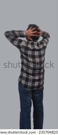back view of the young man's head. isolated on the white background, back view of stres asian man hold the heads with the hand,   Back view asian man hold the heads
