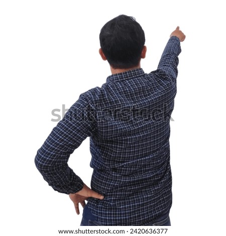 back view of the young man's pointing something isolated on the white background, Back view asian man pointing. 