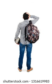 Back View Of Young Student Man Standing With Hand On Head. Man With Backpack And Books. Isolated On White Background