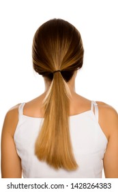 Back View Of Young Woman With Ponytail On White Background