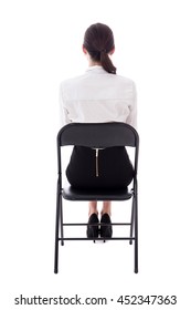 Back View Of Young Woman Sitting On Office Chair Isolated On White Background