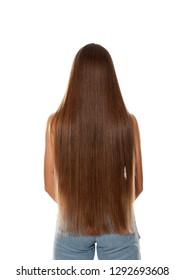 Back view of young woman with very long hair on white background