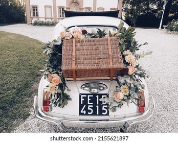 Back Of A Vintage Wedding Car With Suitcase And Decoration Ideas To Celebrate The Best Just Married.