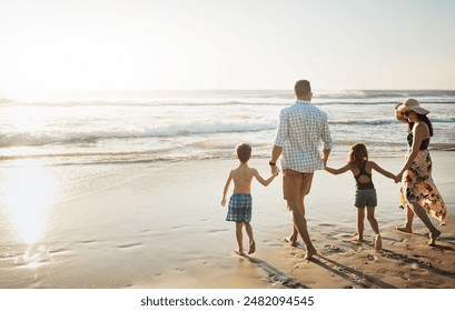 Back, walking and holding hands with family on beach for summer holiday, weekend or bonding together in nature. Mother, father and children strolling on ocean coast for outdoor vacation in sunshine - Powered by Shutterstock