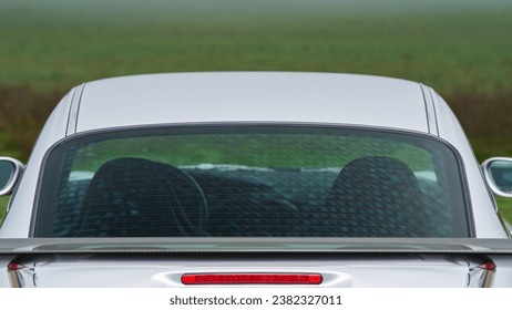 Back window and third brake light on a car