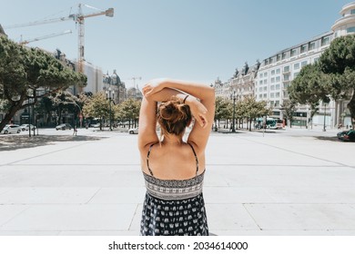 Back Of A Woman In The Main Plaza Of Porto, Oporto, During A Super Sunny Day, Relax And Holiday Concept, Hot Day, Summer, Dress