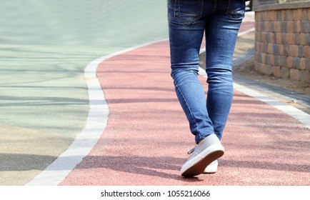 The back of a woman walking. - Powered by Shutterstock