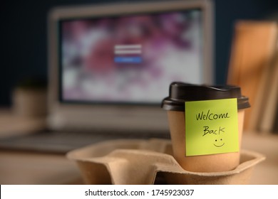 Back to Work Concept. Closeup of Welcome Note on Takeaway Coffee Cup in Office Desk. Message from a Colleague or Boss  