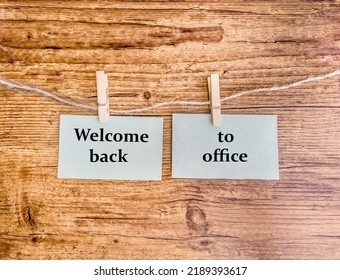 Back To Work Concept. Welcome Back To Office Message Written On Paper Notes On Wooden Background 