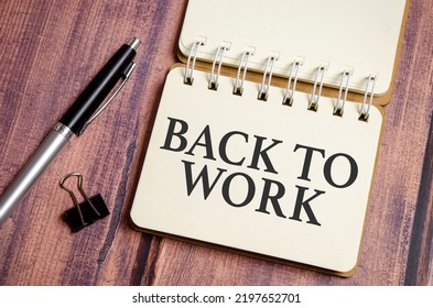 Back To Work Words On Paper With Pen And Wooden Background