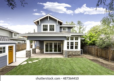 Back yard of craftsman house with great yard, blue home