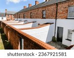 Back yards of a row of Victorian terraced houses at the Ulster Folk Park Museum