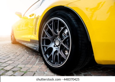 Back of a yellow modern sport car in sunset - Shutterstock ID 448370425