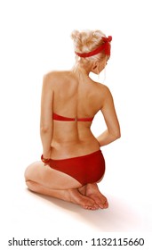 Back Of Young Attractive Blonde Woman In Red Swim Suit On White Background