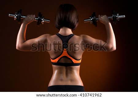 Similar – Rear view portrait of one young athletic woman at crossfit training, exercising with trx suspension fitness straps over dark background