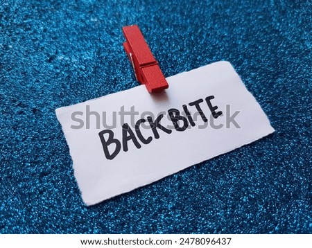Backbite writting on blue background.