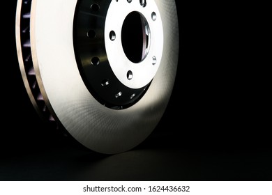backdrop with brake disk on black background with copy space. car part on dark background - Shutterstock ID 1624436632