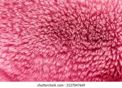 Textura fotográfica de fondo de material de piel animal de color rosa.