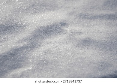 Backdrop with snow texture. Winter surface with snow texture. Cold snowy ground texture. White frozen field under winter sun.