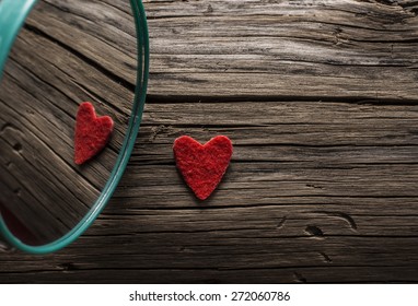 Backdrop of two red hearts lie on old retro vintage aged grunge style background . Valentine's day. Reflection in circle mirror Couple of sign love Idea symbol concept reciprocity, mutually - Shutterstock ID 272060786