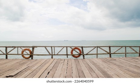 Backdrop wooden fence and boardwalk or piers at the beach. - Powered by Shutterstock
