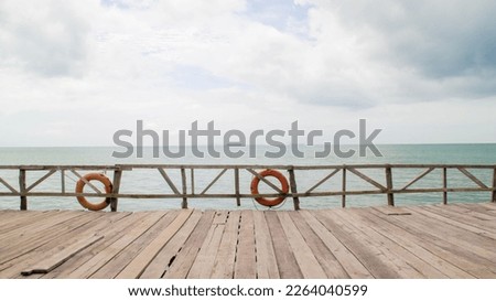 Backdrop wooden fence and boardwalk or piers at the beach.
