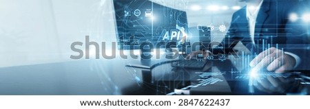 Backend developer working on computer integrating API. Technical expert connecting diverse software systems and streamlining data exchange protocols to improve application functionality.