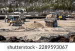 Backfilling works with dumpers and bulldozer for a mine tailings cell