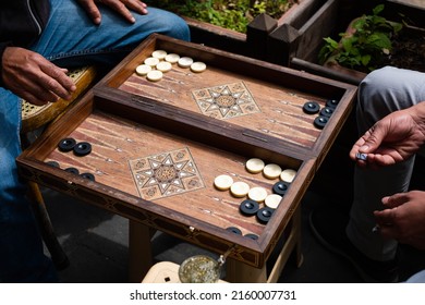 Backgammon, two men playing backgammon