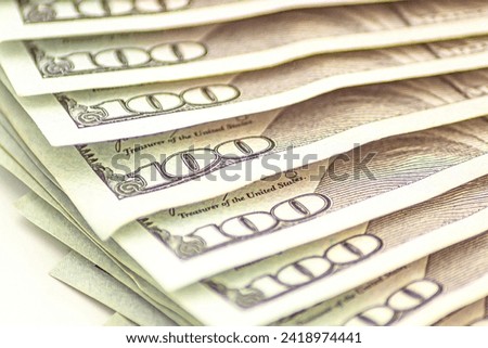 Background of 100 dollar. Macro, close-up money. Lots of 100 dollar bills, the concept of US cash money. US paper. Bribery with a wad of money, cash circulation and money exchange currency