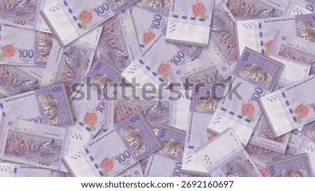 Background of 100  Malaysia Ringgit bills,Group of money stack of 100 Ringgit banknotes a lot of the background texture, top view