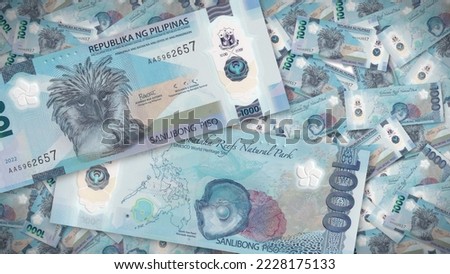 Background of 1000 Piso banknote,Group of money stack of New 1000 Philippine banknote a lot of the background texture, top view