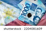 Background of 1000 Piso Philipines Front and back banknote on the Flag of Philipines of the background texture, top view