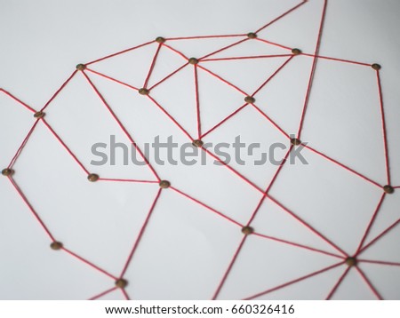 Background. Abstract concept (idea) of network, social media, internet, teamwork,  communication. Thumbtacks linked together by red thread. Isolated. Entities connected.