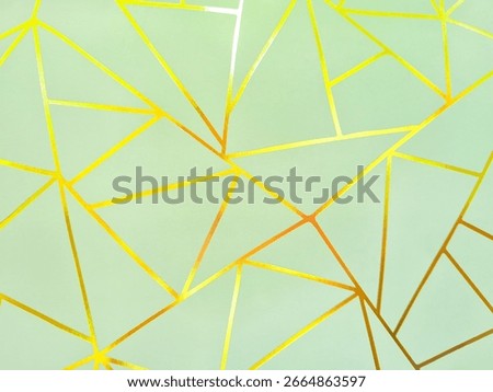 Background of abstract geometric shape pattern with shiny gold lines on pastel green color. Abstract geometric decorative pattern on mint green background. Handmade low poly pattern for decoration.