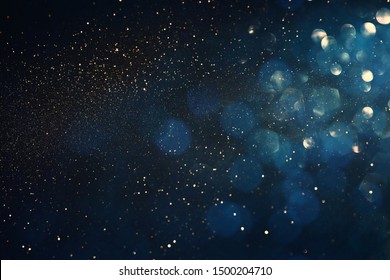 background of abstract glitter lights. blue, gold and black. de focused - Shutterstock ID 1500204710