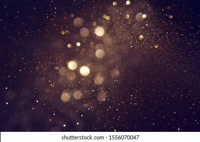 background of abstract glitter lights. gold and black. de focused - Shutterstock ID 1556070047