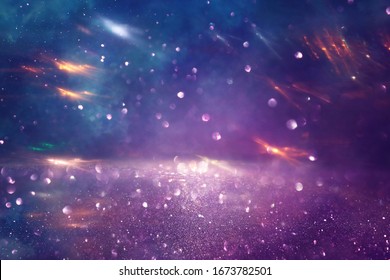 background of abstract glitter lights. gold, blue and purple. de focused - Shutterstock ID 1673782501