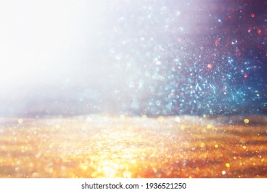 background of abstract gold, blue and silver glitter lights. defocused - Shutterstock ID 1936521250