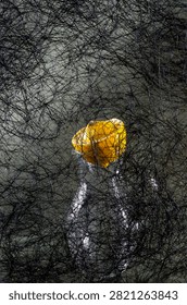 Background of abstract interwoven plastic thread against a backdrop of various objects