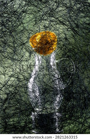 Background of abstract interwoven plastic thread against a backdrop of various objects