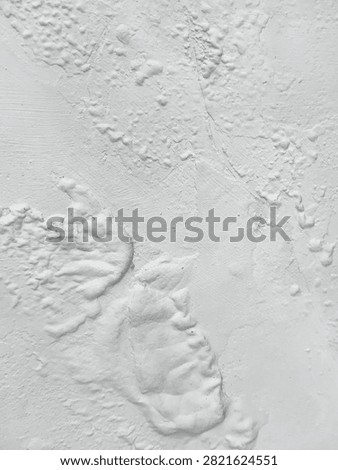 Background abstract pattern of white wall texture with paint surface that bubbles and blisters due to water seepage or high humidity. Concept of renovation, building damage, or industrial grunge.
