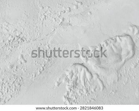 Background abstract pattern of white wall texture with paint surface that bubbles and blisters due to water seepage or high humidity. Concept of renovation, building damage, or industrial grunge.